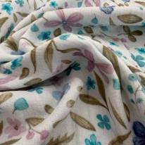Musselin Stoff bedruckt mit verschiedenen Blumen in verschiedenen Blautönen